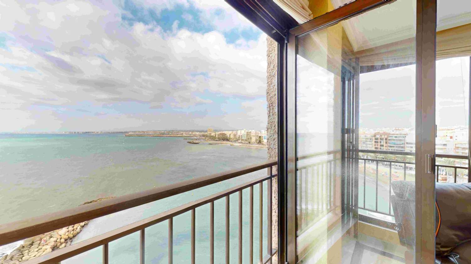 BEACHFRONT APARTMENT WITH SEA VIEWS AND GARAGE IN THE PRESTIGIOUS PLAYA DEL CURA