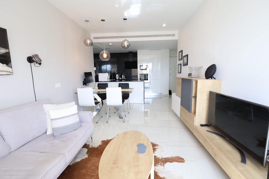 MODERN APARTMENT IN EXCLUSIVE RESIDENTIAL AMANECER 3 WITH LARGE TERRACE AND TWO PARKING SPACES